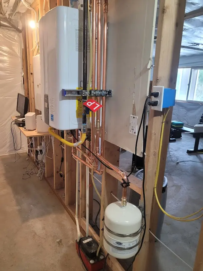 Licensed plumber repairing a kitchen sink in Brimfield